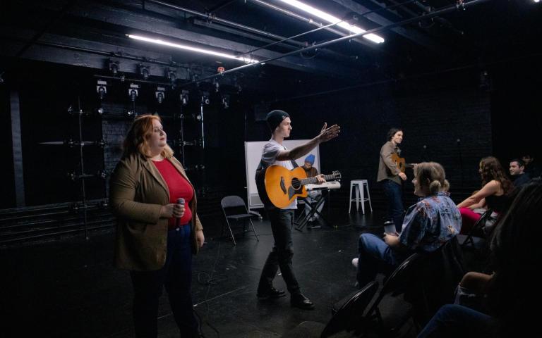 Students performing on stage