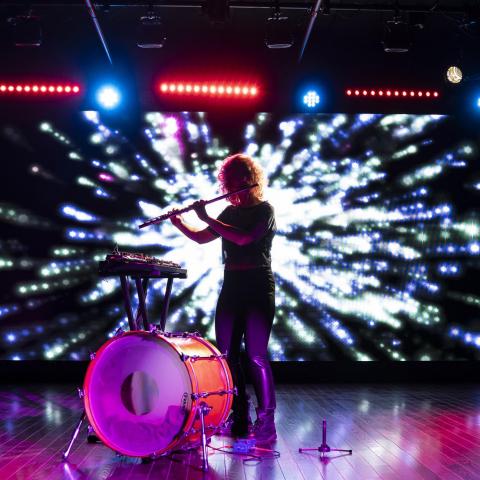 Photo of a student performing in Berklee NYC’s Black Box Theater 