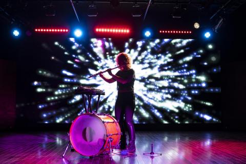 Photo of a student performing in Berklee NYC’s Black Box Theater 