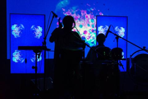 Backlit performer on stage
