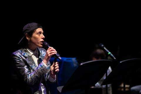 Actor on stage with microphone
