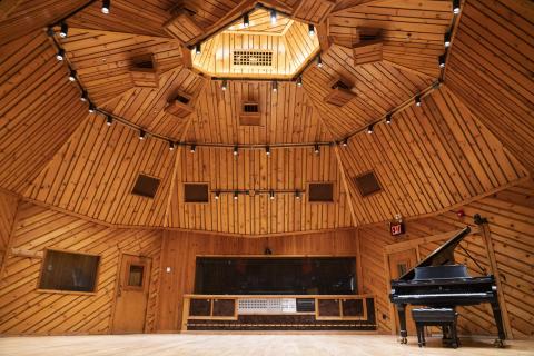 Photo of a Grand Piano inside a large studio live room