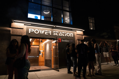 Students gathered outside Power Station at night