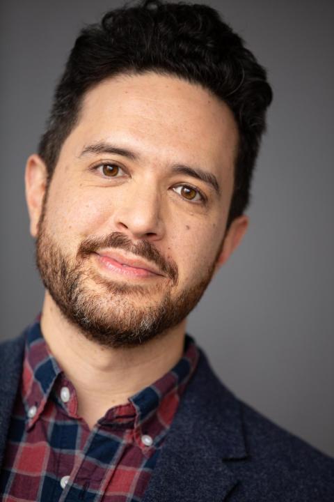 Adam Gwon in front of grey backdrop